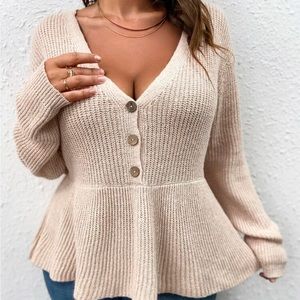 Plunging neck peplum sweater